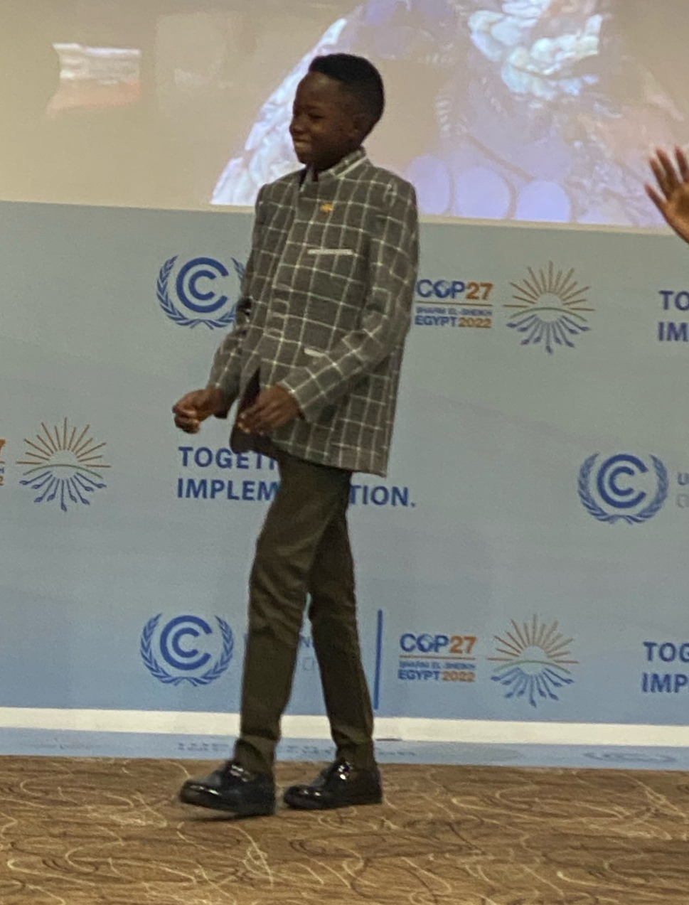 Picture: the child Asaad at the climate summit in Sharm el Sheikh on his way to tell how he fled from Sudan to Egypt after the floods destroyed his home. Mohammed Mansour via Facebook.